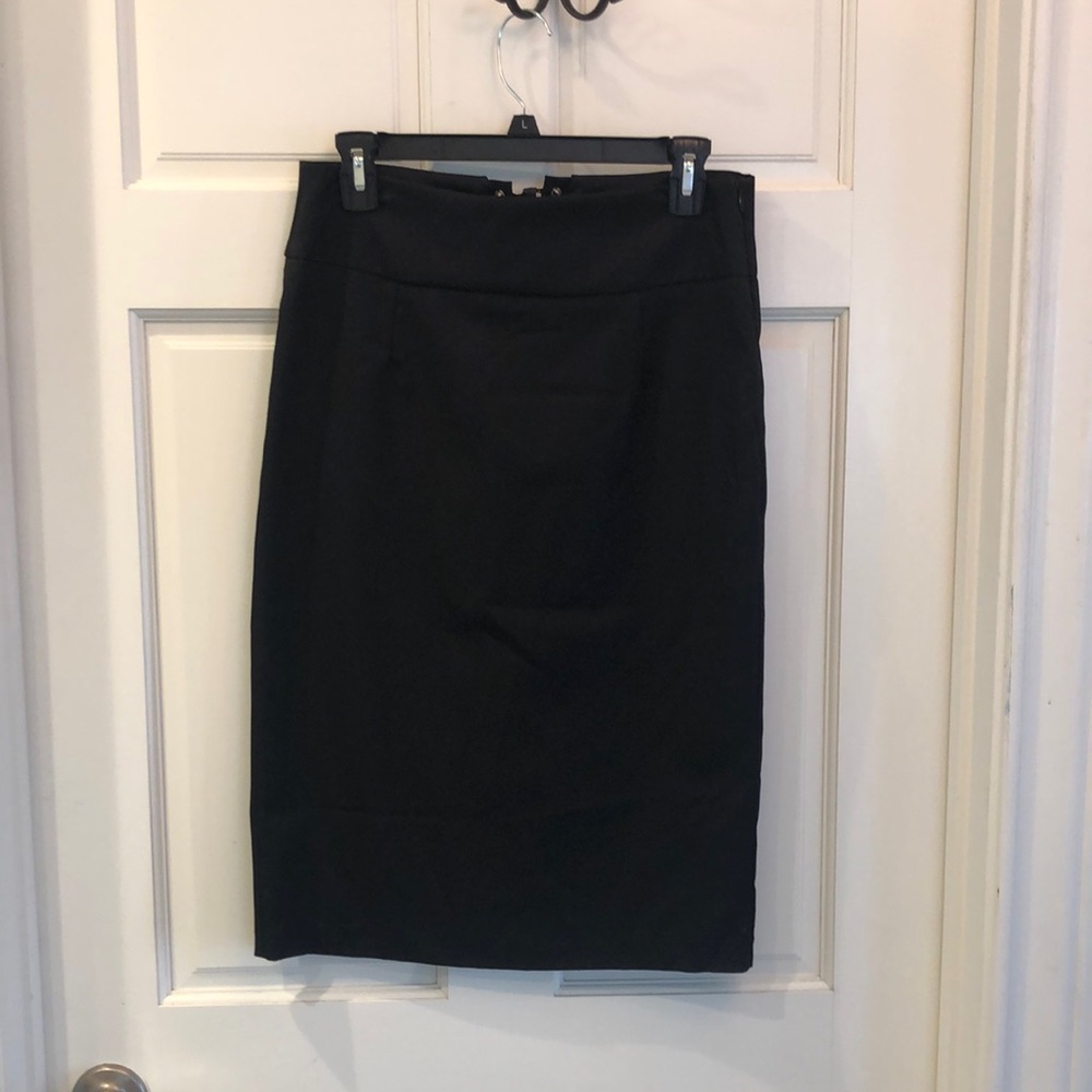 Black pencil skirt with polka dot ribbon tie in back. Very cute like new